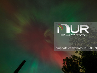 The Aurora Borealis, or Northern Lights, is visible over Chisago City, Minnesota, due to a major geomagnetic storm and heightened solar acti...