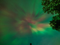 The Aurora Borealis, or Northern Lights, is visible over Chisago City, Minnesota, due to a major geomagnetic storm and heightened solar acti...