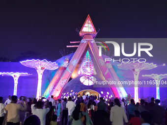 Devotees visit the puja pandal where the idol of Hindu Goddess 'Durga' is worshiped during the Durga Puja festival celebrations in Siliguri,...