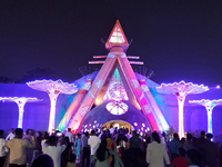 Devotees visit the puja pandal where the idol of Hindu Goddess 'Durga' is worshiped during the Durga Puja festival celebrations in Siliguri,...