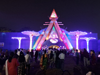 Devotees visit the puja pandal where the idol of Hindu Goddess 'Durga' is worshiped during the Durga Puja festival celebrations in Siliguri,...