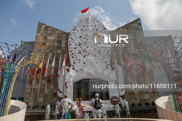 Tourists visit the Bali Bombing Memorial during the 22nd commemoration of the 2002 Bali bombing tragedy in Kuta, Bali, Indonesia, on October...