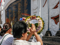 Relatives of the victims of the 2002 Bali bombings pray in front of the Bali Bombing Memorial during the 22nd commemoration of the attacks i...