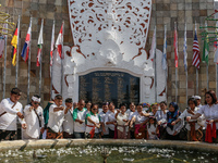 Relatives of the victims of the 2002 Bali bombings tragedy throw flowers in front of the Bali Bombing Memorial during the 22nd commemoration...