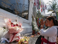 Relatives of the victims of the 2002 Bali bombings pray in front of the Bali Bombing Memorial during the 22nd commemoration of the attacks i...