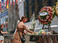 Tourists lay flowers at the Bali Bombing Memorial during the 22nd commemoration of the 2002 Bali bombing tragedy in Kuta, Bali, Indonesia, o...