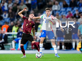 Zeno Debast of Belgium and Niccolo' Pisilli of Italy compete for the ball during the UEFA Nations League 2024/25 League A Group A2 match bet...