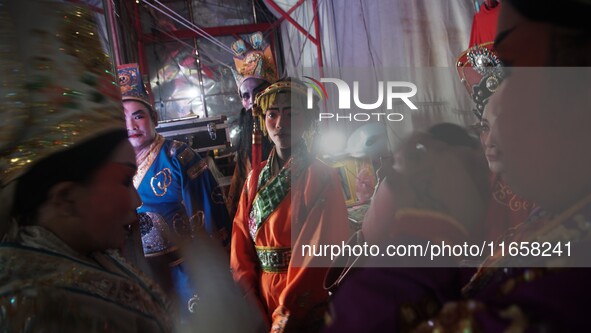 Chinese opera performers are backstage during the Vegetarian Festival at a Chinese shrine in Bangkok, Thailand, on October 7, 2024. The Vege...