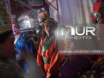 Chinese opera performers are backstage during the Vegetarian Festival at a Chinese shrine in Bangkok, Thailand, on October 7, 2024. The Vege...