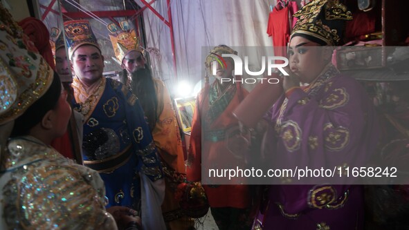 Chinese opera performers are backstage during the Vegetarian Festival at a Chinese shrine in Bangkok, Thailand, on October 7, 2024. The Vege...