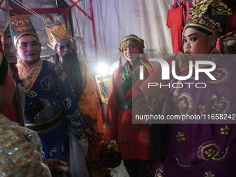 Chinese opera performers are backstage during the Vegetarian Festival at a Chinese shrine in Bangkok, Thailand, on October 7, 2024. The Vege...