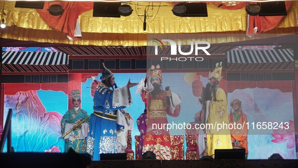 Chinese opera performers are on stage during the Vegetarian Festival at a Chinese shrine in Bangkok, Thailand, on October 7, 2024. The Veget...