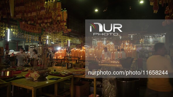 People gather at a Chinese shrine during the Vegetarian Festival in Chinatown in Bangkok, Thailand, on October 7, 2024. The Vegetarian Festi...