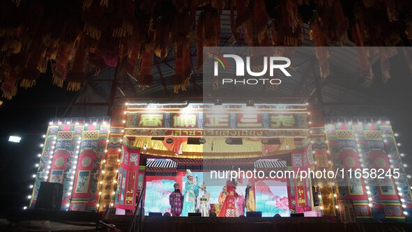 Chinese opera performers are on stage during the Vegetarian Festival at a Chinese shrine in Bangkok, Thailand, on October 7, 2024. The Veget...