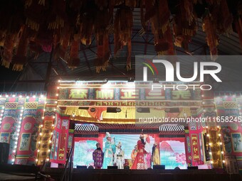 Chinese opera performers are on stage during the Vegetarian Festival at a Chinese shrine in Bangkok, Thailand, on October 7, 2024. The Veget...