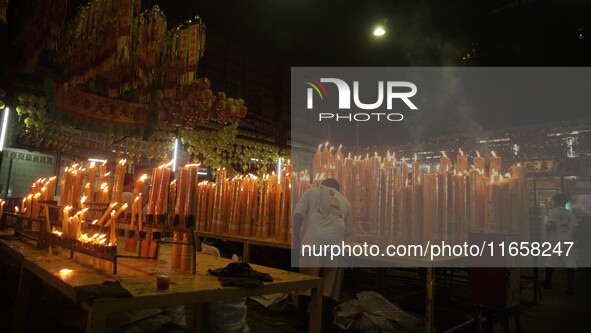 People gather at a Chinese shrine during the Vegetarian Festival in Chinatown in Bangkok, Thailand, on October 7, 2024. The Vegetarian Festi...