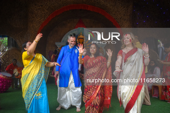 Devotees dance during the final day ''Vijayadashami,'' marking the end of the Durga Puja festival in Kolkata, India, on October 12, 2024. 