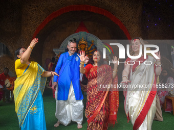 Devotees dance during the final day ''Vijayadashami,'' marking the end of the Durga Puja festival in Kolkata, India, on October 12, 2024. (