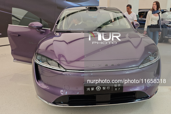 A new energy vehicle is displayed at the Huawei Global flagship store on Nanjing Road Pedestrian Street in Shanghai, China, on October 12, 2...