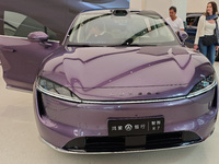 A new energy vehicle is displayed at the Huawei Global flagship store on Nanjing Road Pedestrian Street in Shanghai, China, on October 12, 2...