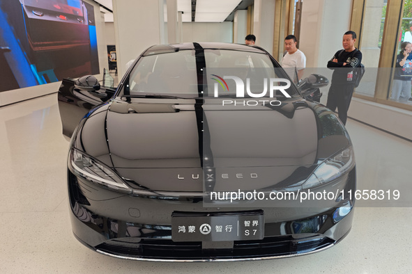 A new energy vehicle is displayed at the Huawei Global flagship store on Nanjing Road Pedestrian Street in Shanghai, China, on October 12, 2...