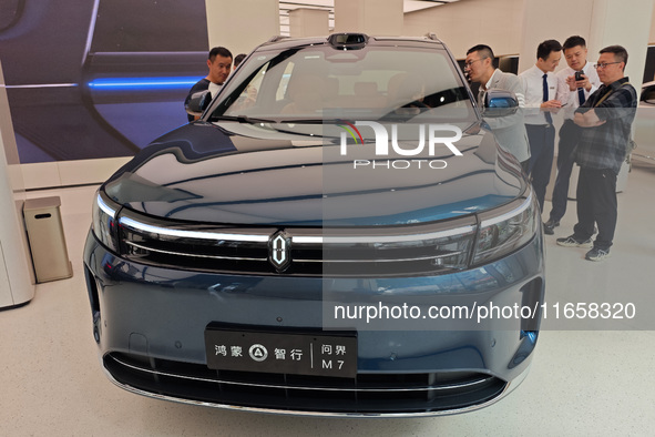 A new energy vehicle is displayed at the Huawei Global flagship store on Nanjing Road Pedestrian Street in Shanghai, China, on October 12, 2...