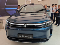 A new energy vehicle is displayed at the Huawei Global flagship store on Nanjing Road Pedestrian Street in Shanghai, China, on October 12, 2...