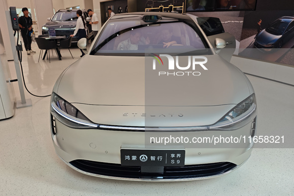 A new energy vehicle is displayed at the Huawei Global flagship store on Nanjing Road Pedestrian Street in Shanghai, China, on October 12, 2...