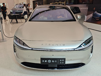 A new energy vehicle is displayed at the Huawei Global flagship store on Nanjing Road Pedestrian Street in Shanghai, China, on October 12, 2...