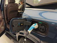 A new energy vehicle is displayed at the Huawei Global flagship store on Nanjing Road Pedestrian Street in Shanghai, China, on October 12, 2...