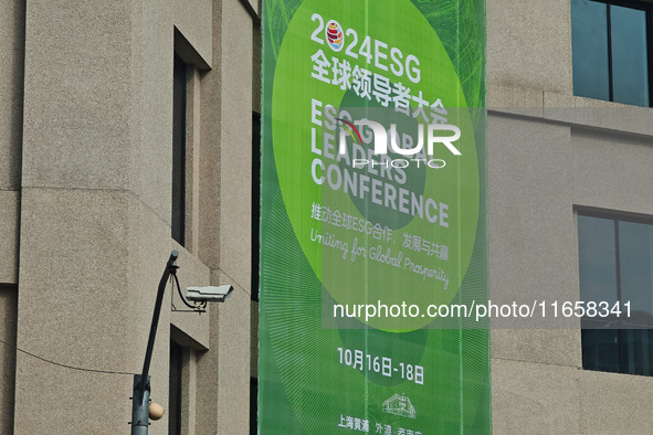 A poster for the 2024 ESG Global Leadership Conference, held from October 16 to 18, 2024, stands out on the wall of the Old City Building in...