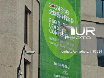 A poster for the 2024 ESG Global Leadership Conference, held from October 16 to 18, 2024, stands out on the wall of the Old City Building in...