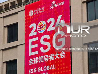 A poster for the 2024 ESG Global Leadership Conference, held from October 16 to 18, 2024, stands out on the wall of the Old City Building in...