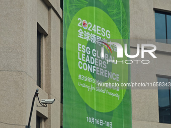 A poster for the 2024 ESG Global Leadership Conference, held from October 16 to 18, 2024, stands out on the wall of the Old City Building in...