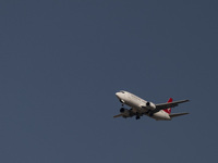 An Iranian airliner flies over the sky in southern Tehran, Iran, on October 11, 2023. (