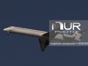 An Iranian airliner flies over the sky in southern Tehran, Iran, on October 11, 2023. (