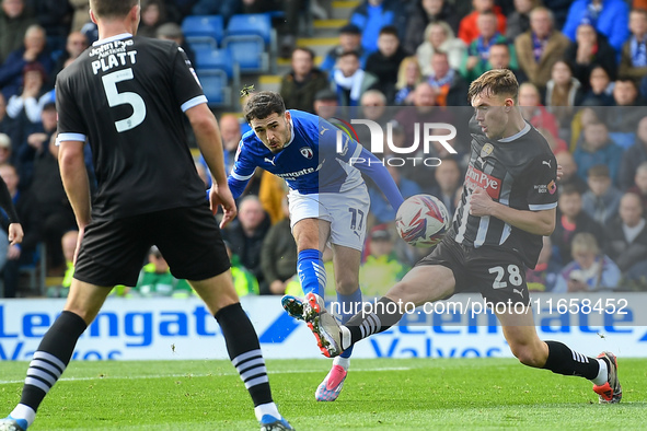 Armando Dobra of Chesterfield shoots at goal under pressure from Lewis Macari of Notts County during the Sky Bet League 2 match between Ches...