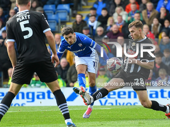 Armando Dobra of Chesterfield shoots at goal under pressure from Lewis Macari of Notts County during the Sky Bet League 2 match between Ches...