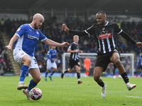 Paddy Madden of Chesterfield is under pressure from Jacob Bedeau of Notts County during the Sky Bet League 2 match between Chesterfield and...