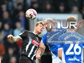 Matt Palmer of Notts County battles with Paddy Madden of Chesterfield during the Sky Bet League 2 match between Chesterfield and Notts Count...