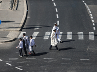 A person walks on a crosswalk on an empty street on Yom Kippur, the Jewish day of atonement and the holiest day in the Jewish calendar, amid...