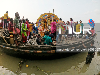 Maharaja Naba Krishna starts Durga Puja in 1757 at Sovabazar Royal Place. An idol of Goddess Durga is carried on a boat to the middle of the...