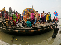 Maharaja Naba Krishna starts Durga Puja in 1757 at Sovabazar Royal Place. An idol of Goddess Durga is carried on a boat to the middle of the...