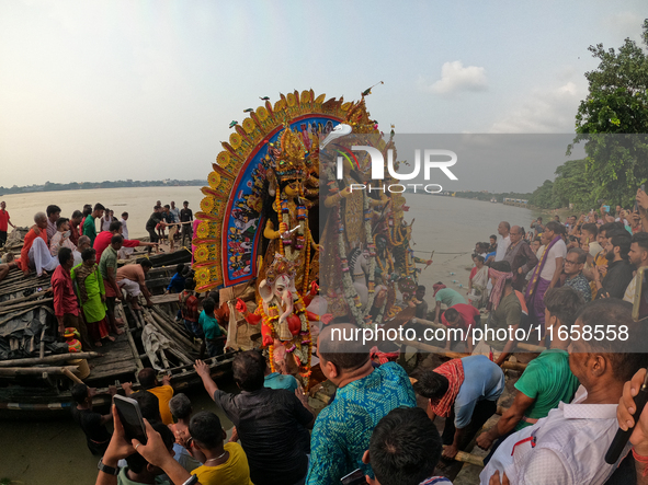 Maharaja Naba Krishna starts Durga Puja in 1757 at Sovabazar Royal Palace. An idol of Goddess Durga is seen being uploaded onto two boat mid...