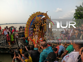 Maharaja Naba Krishna starts Durga Puja in 1757 at Sovabazar Royal Palace. An idol of Goddess Durga is seen being uploaded onto two boat mid...