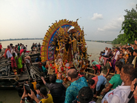 Maharaja Naba Krishna starts Durga Puja in 1757 at Sovabazar Royal Palace. An idol of Goddess Durga is seen being uploaded onto two boat mid...