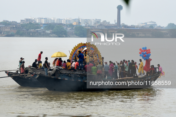 Maharaja Naba Krishna starts Durga Puja in 1757 at Sovabazar Royal Palace. An idol of Goddess Durga is seen being uploaded onto two boat mid...