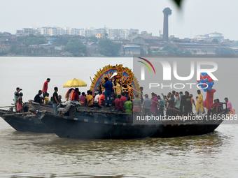 Maharaja Naba Krishna starts Durga Puja in 1757 at Sovabazar Royal Palace. An idol of Goddess Durga is seen being uploaded onto two boat mid...