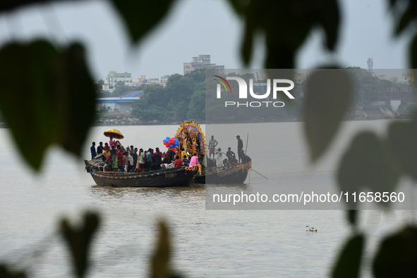 Maharaja Naba Krishna starts Durga Puja in 1757 at Sovabazar Royal Palace. An idol of Goddess Durga is seen being uploaded onto two boat mid...