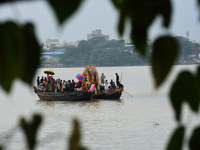 Maharaja Naba Krishna starts Durga Puja in 1757 at Sovabazar Royal Palace. An idol of Goddess Durga is seen being uploaded onto two boat mid...